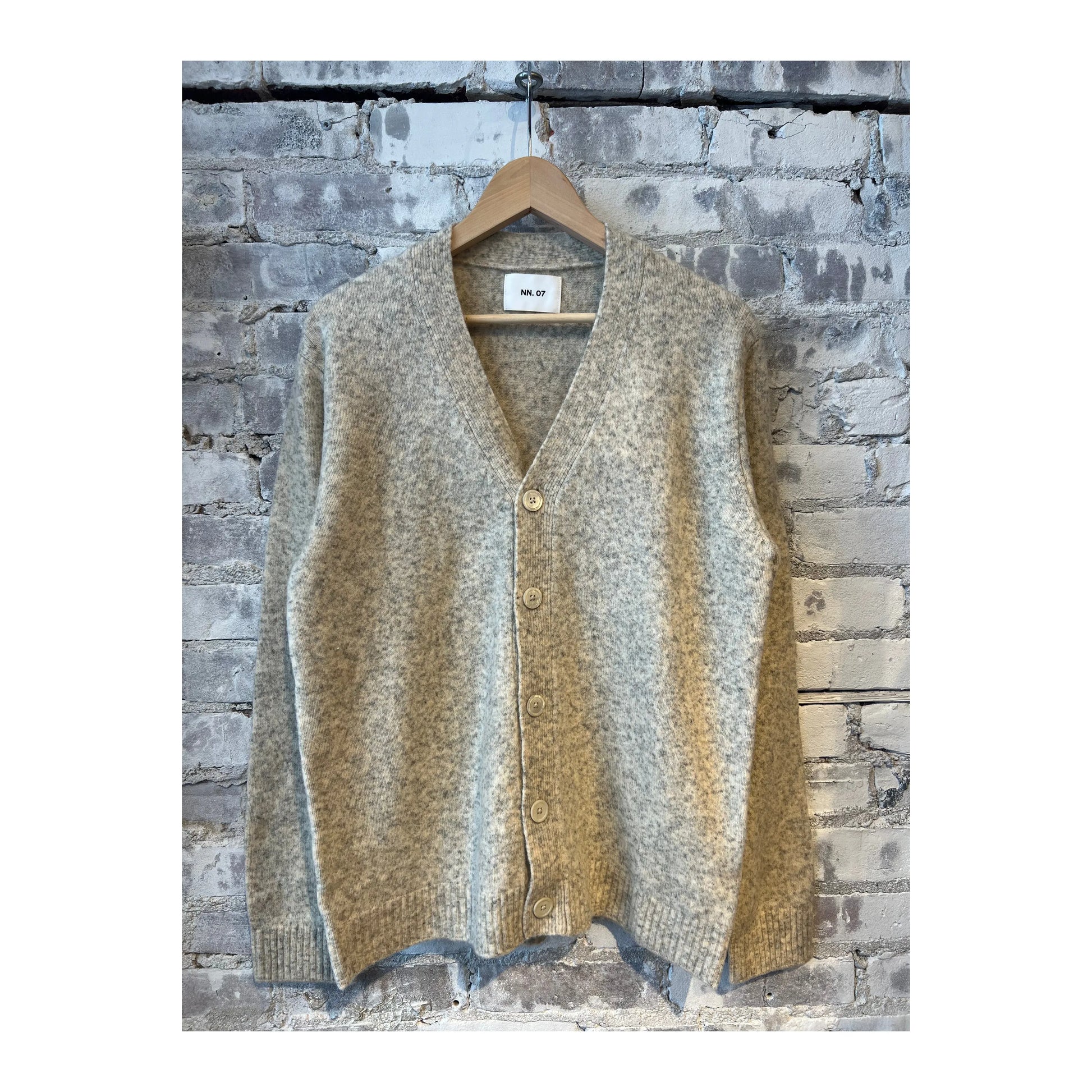 Men's white John V-Neck cardigan by NN07, featuring a classic V-neck design and soft knit fabric.