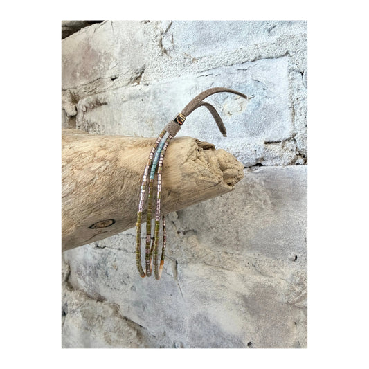 Julie Rofman Carmel Triple Strand Bracelet featuring elegant brown and gold-toned jewelry with delicate beaded strands.