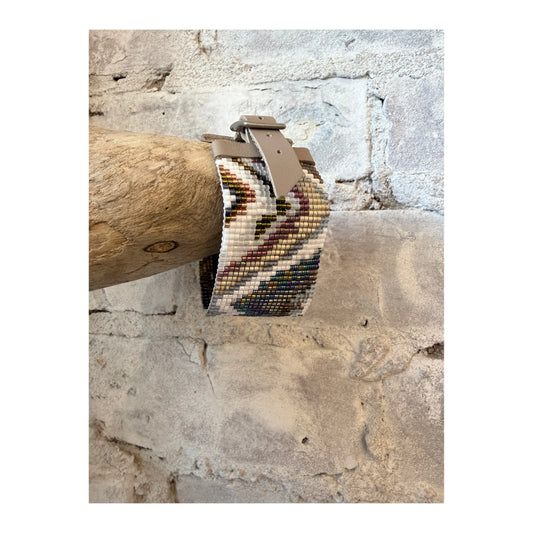 Julie Rofman JR22 Tahiti Medium Cuff jewelry in silver with intricate design, worn on wrist in close-up shot.