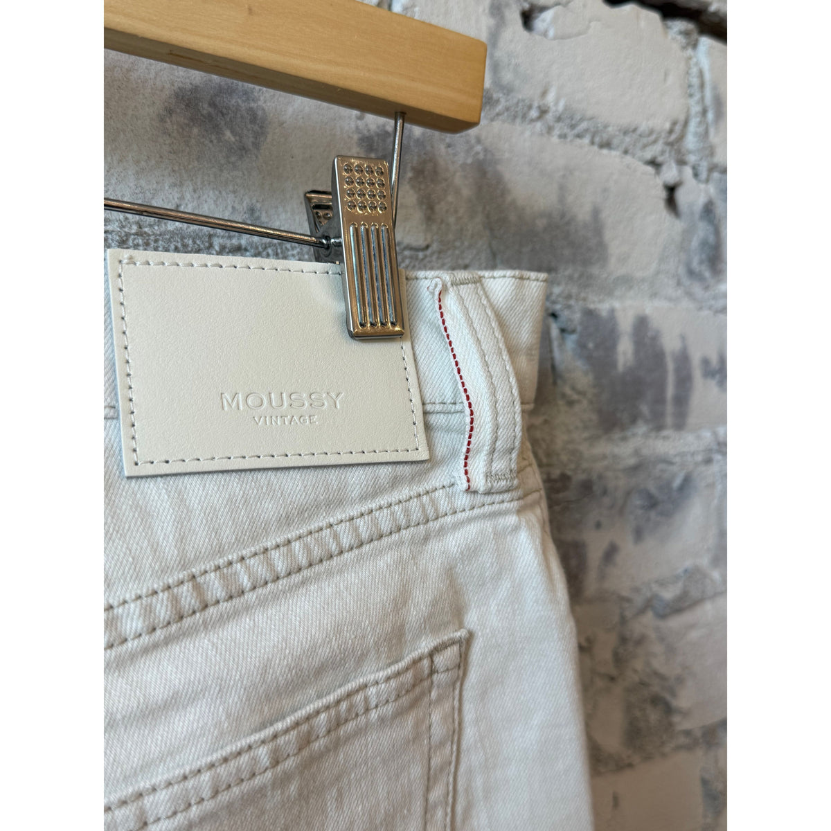 Women's Moussy Keane Slim Straight White Jean displayed on a model, showcasing classic fit and clean white denim style.