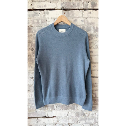 Men's Kevin ribbed organic cotton sweater in stone blue by NN07, featuring a close-up of the textured knit fabric.