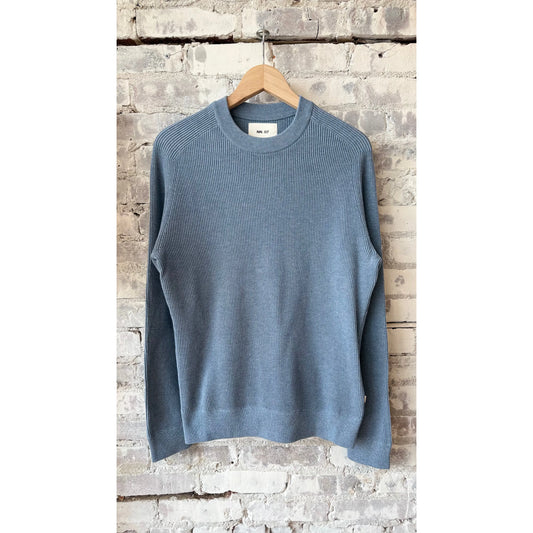 Men's Kevin ribbed organic cotton sweater in stone blue by NN07, featuring a close-up of the textured knit fabric.