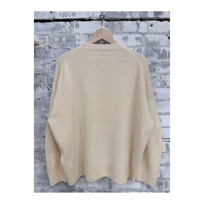 Women's V::Room long-sleeve merino jersey knit crew in natural, soft and comfortable, shown laid flat with visible collar and sleeve details.