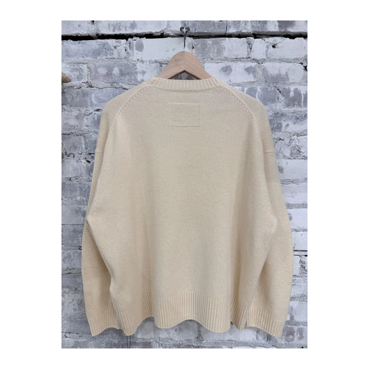 Women's V::Room long-sleeve merino jersey knit crew in natural, soft and comfortable, shown laid flat with visible collar and sleeve details.