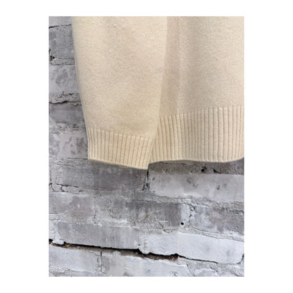 Women's V::Room long-sleeve merino jersey knit crew in natural color, shown on a model with a close-up of the textured fabric.