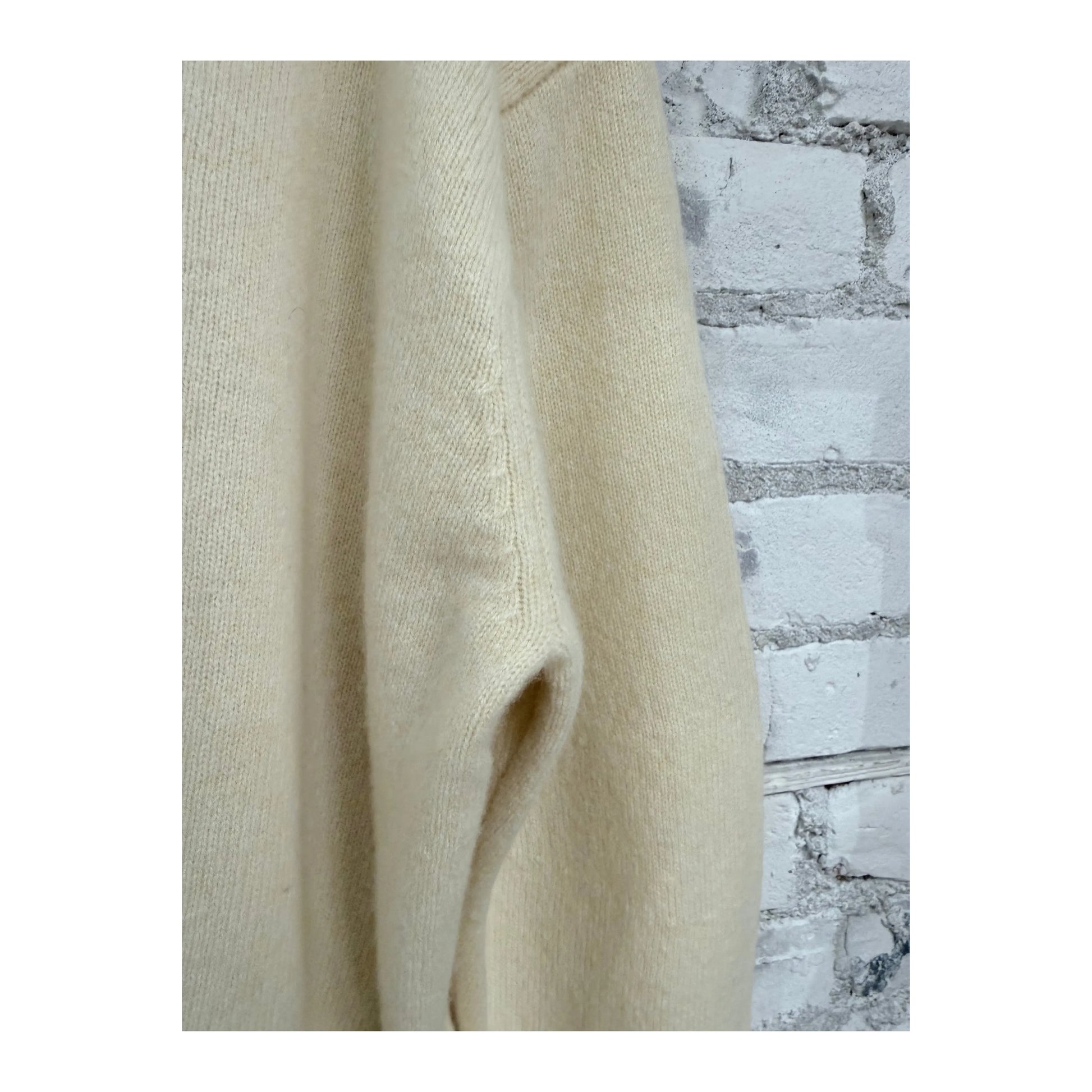 Women's natural V::Room long-sleeve merino jersey knit crew top, soft and comfortable, shown in a close-up view.