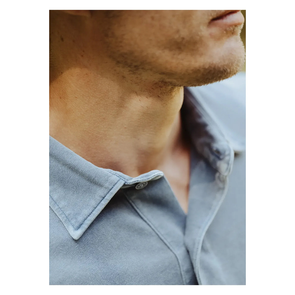 Men's navy long-sleeve organic recycled polo shirt by Save Khaki United, featuring a classic collar and button placket.