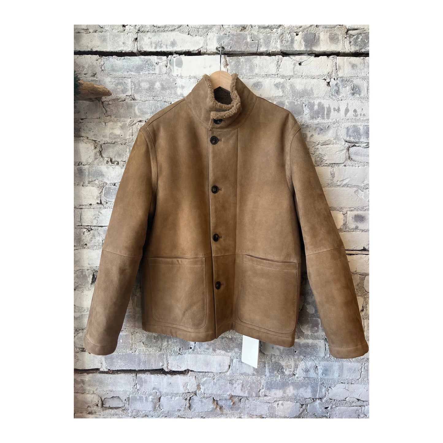 Men's closed brand lambskin jacket in chestnut color, featuring a smooth leather texture and classic style.