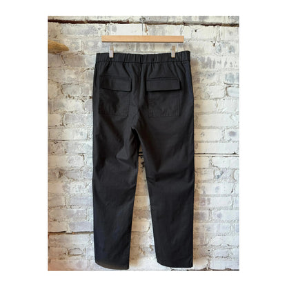 Men's black Lico Workwear pant with durable fabric, featuring a straight fit and multiple pockets for functional workwear.