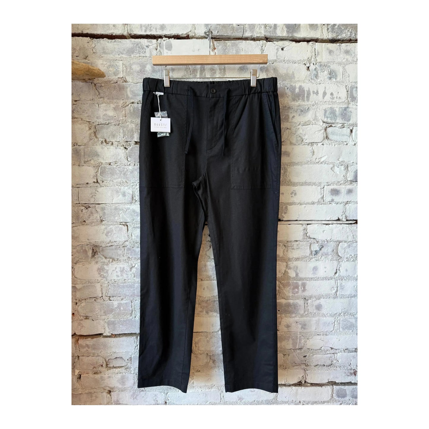 Men's black Lico Workwear pant with practical design and sturdy fabric, suitable for work or casual wear.