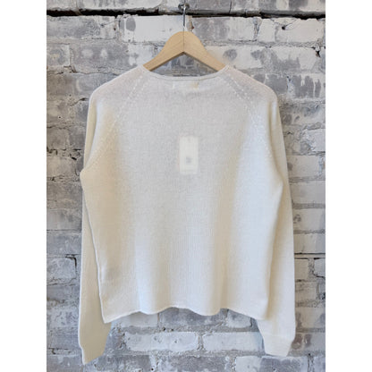 Women's lightweight Merz b. Schwanen Merino wool, cashmere, and silk crew neck sweater in natural color, close-up view.