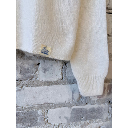 Women's lightweight Merz b. Schwanen Merino wool, cashmere, and silk crew neck sweater in natural color, shown on a model.
