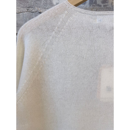 Women's lightweight Merz b. Schwanen Merino wool, cashmere, and silk crew neck sweater in natural color, close-up view.