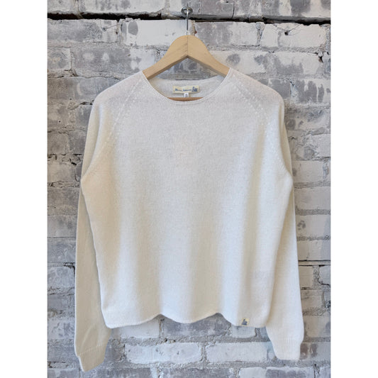 Women's lightweight Merz B. Schwanen Merino wool, cashmere, and silk crew neck sweater, natural color, close-up view.