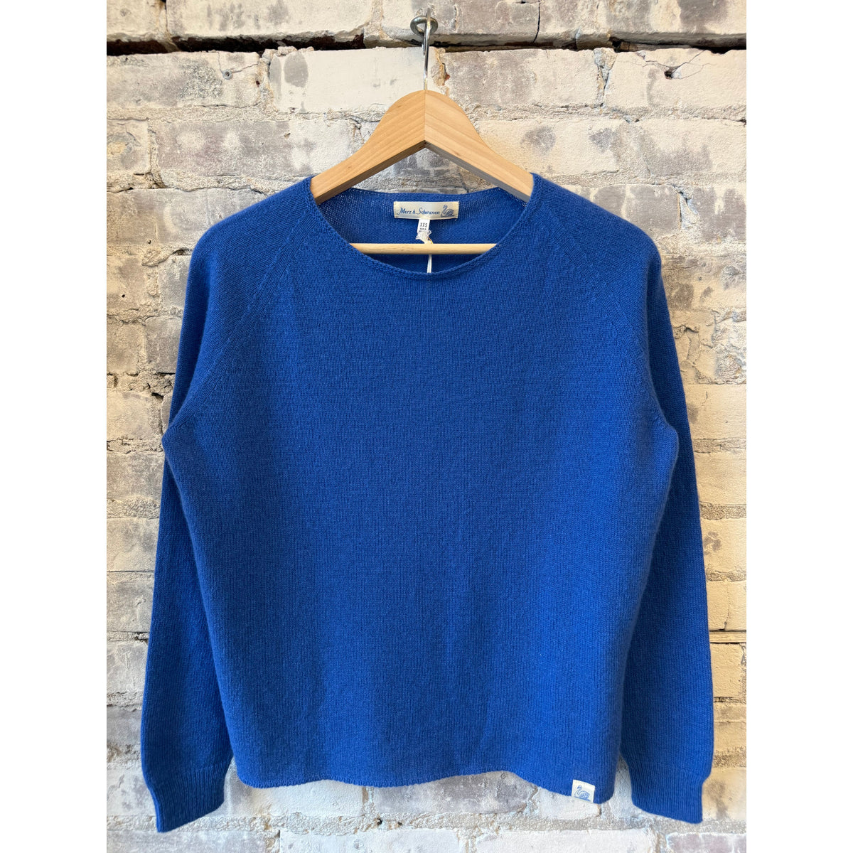 Women's lightweight Merz b. Schwanen crew neck sweater in washed blue merino wool, cashmere, and silk blend.