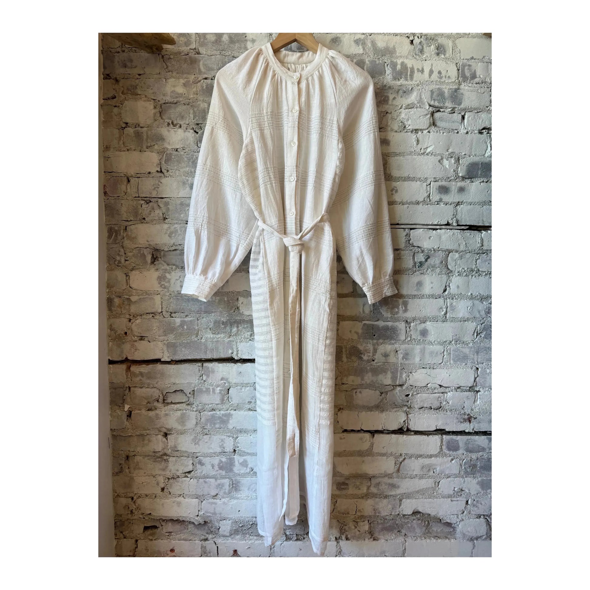 LemLem Makeda Button Up Dress for women in Abira White, showcasing a stylish, lightweight white dress with button details.