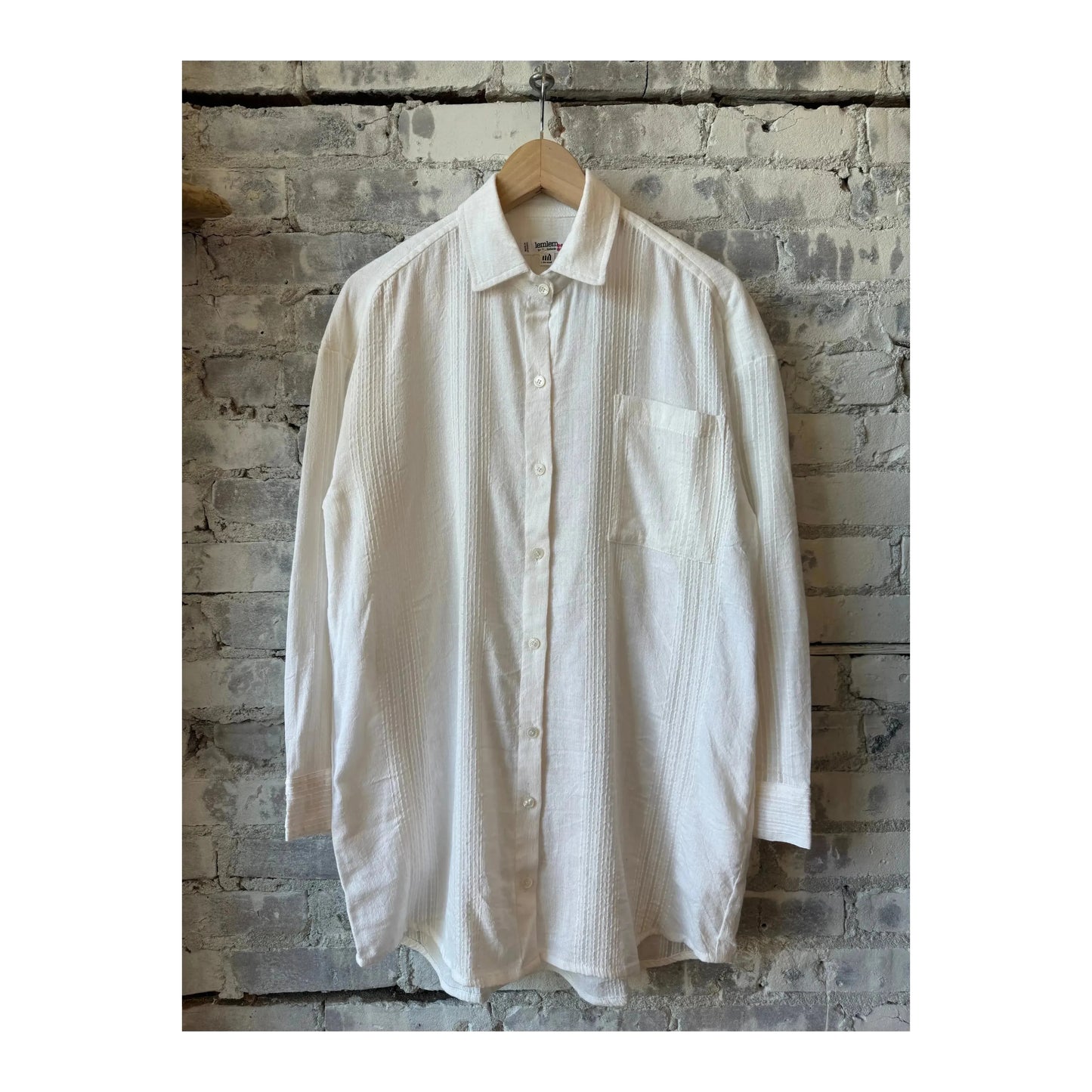 White Mariam shirt for women by LemLem, featuring elegant traditional design and lightweight fabric.