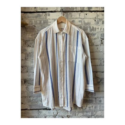LemLem Mariam Shirt Dress in Tiki Azure, women's lightweight dress with a relaxed fit and vibrant blue pattern, displayed on a hanger.