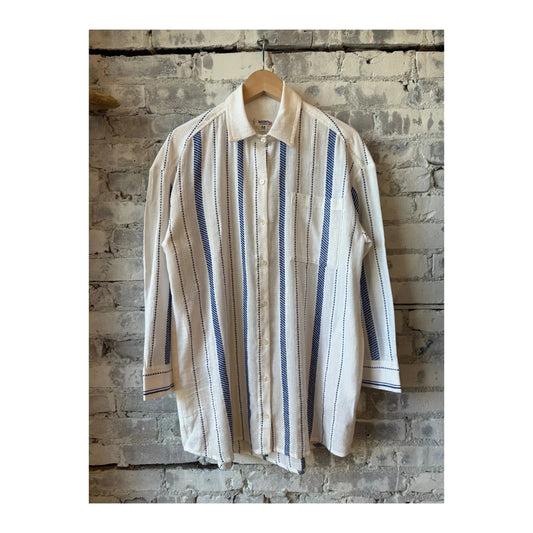 LemLem Mariam Shirt Dress in Tiki Azure, women's lightweight dress with a relaxed fit and vibrant blue pattern, displayed on a hanger.