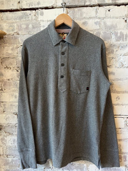 Men's Mariner Polo shirt by Relwen in charcoal with navy and white stripe pattern, showcasing a casual fit and classic collar.