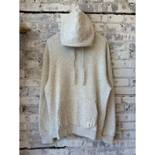 Men's grey La Paz Matias Hood sweatshirt shown on a model, featuring a casual fit and comfortable design.