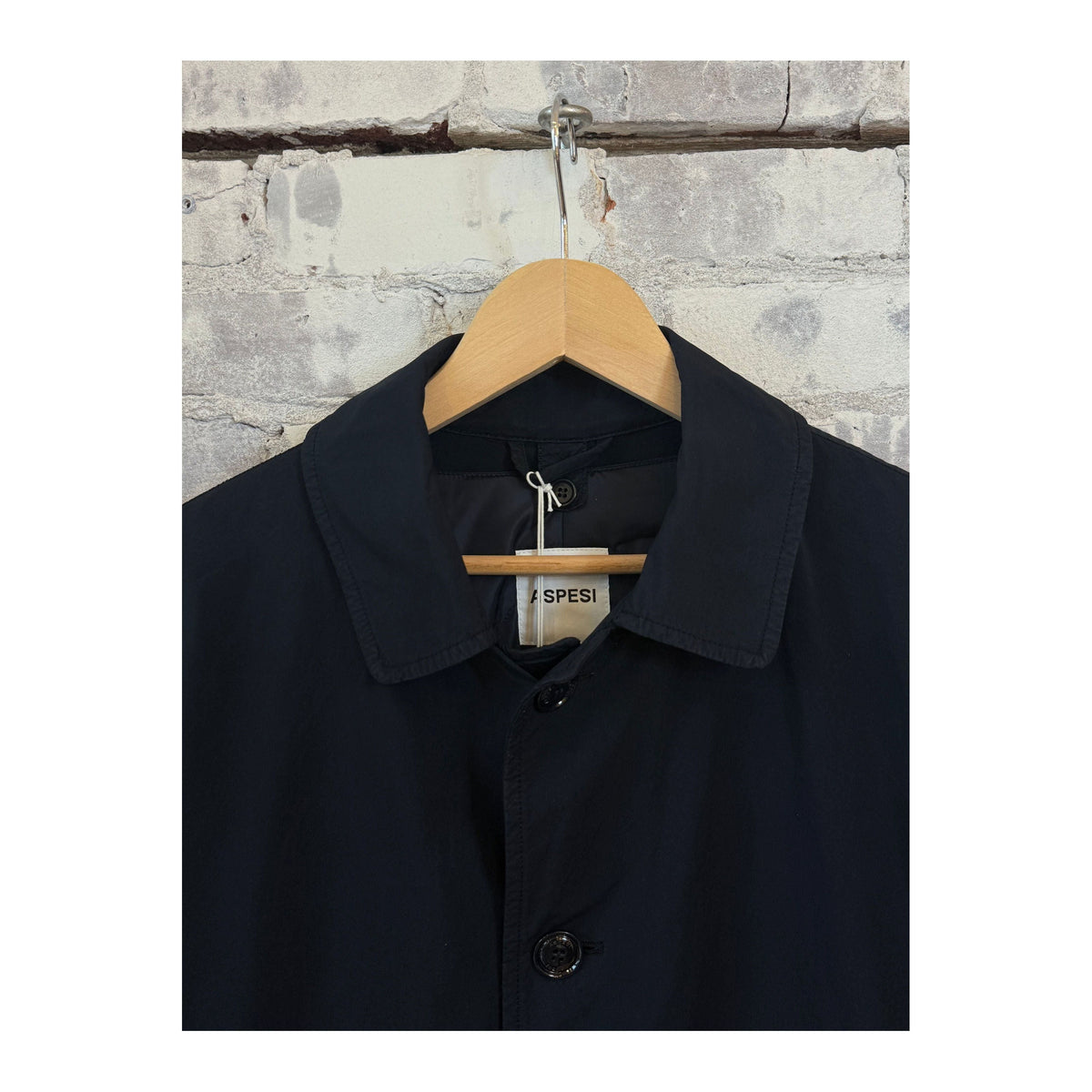Men's navy Aspesi 2-in-1 garment dyed car coat, showcasing the stylish outerwear with a button-up front and tailored fit.