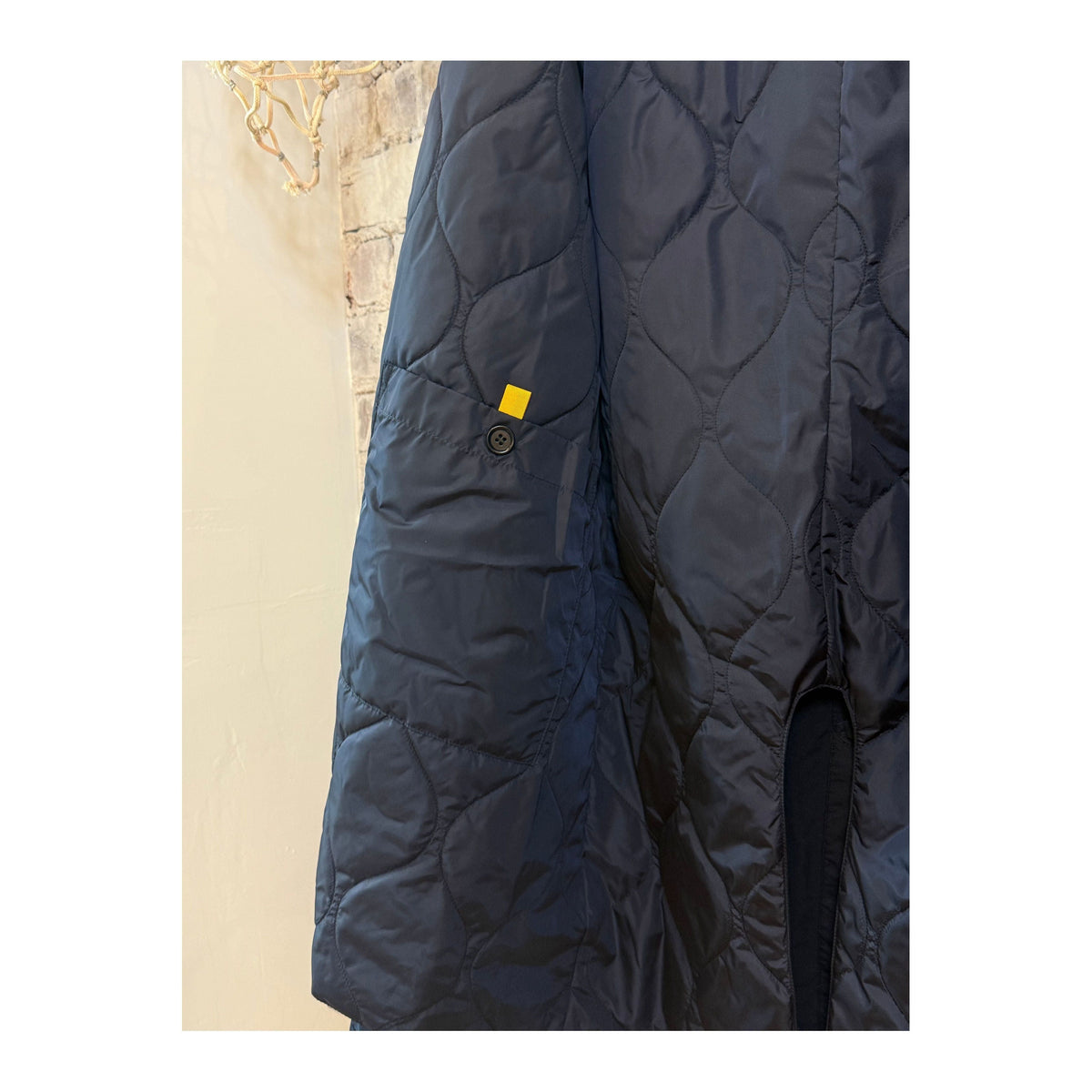Men's navy 2-in-1 garment dyed car coat by Aspesi, shown in a close-up image highlighting the fabric and design details.