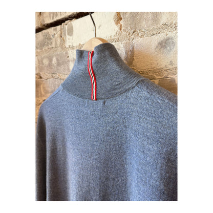 Men's boiled denim blue half zip sweater by Amundsen, showing the textured fabric and half zip detail on a plain background.
