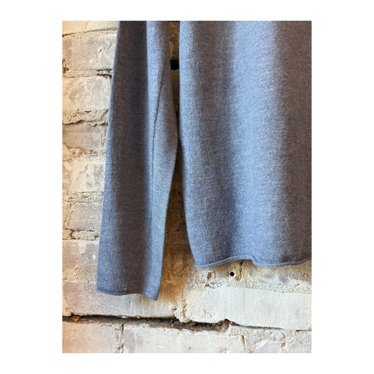 Men's boiled denim blue half zip sweater by Amundsen, featuring a close-up of the half zip collar and textured fabric.