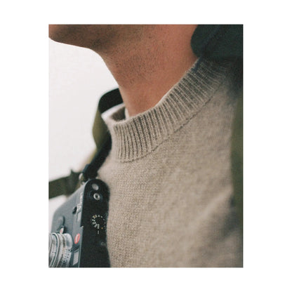 Men's Amundsen Lodge Sweater in camel, cozy knit with a classic fit, shown in a natural setting.