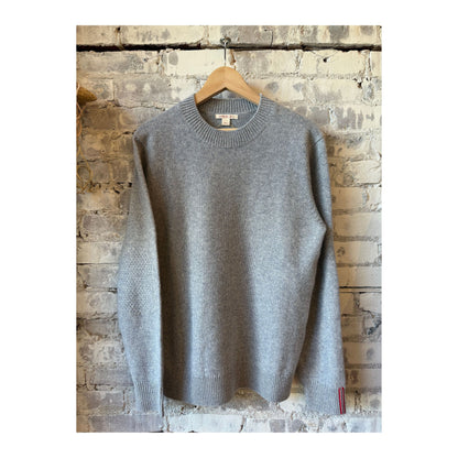 Men's Amundsen Lodge Sweater in Husky Grey, showing the knitted crewneck design and textured wool fabric.