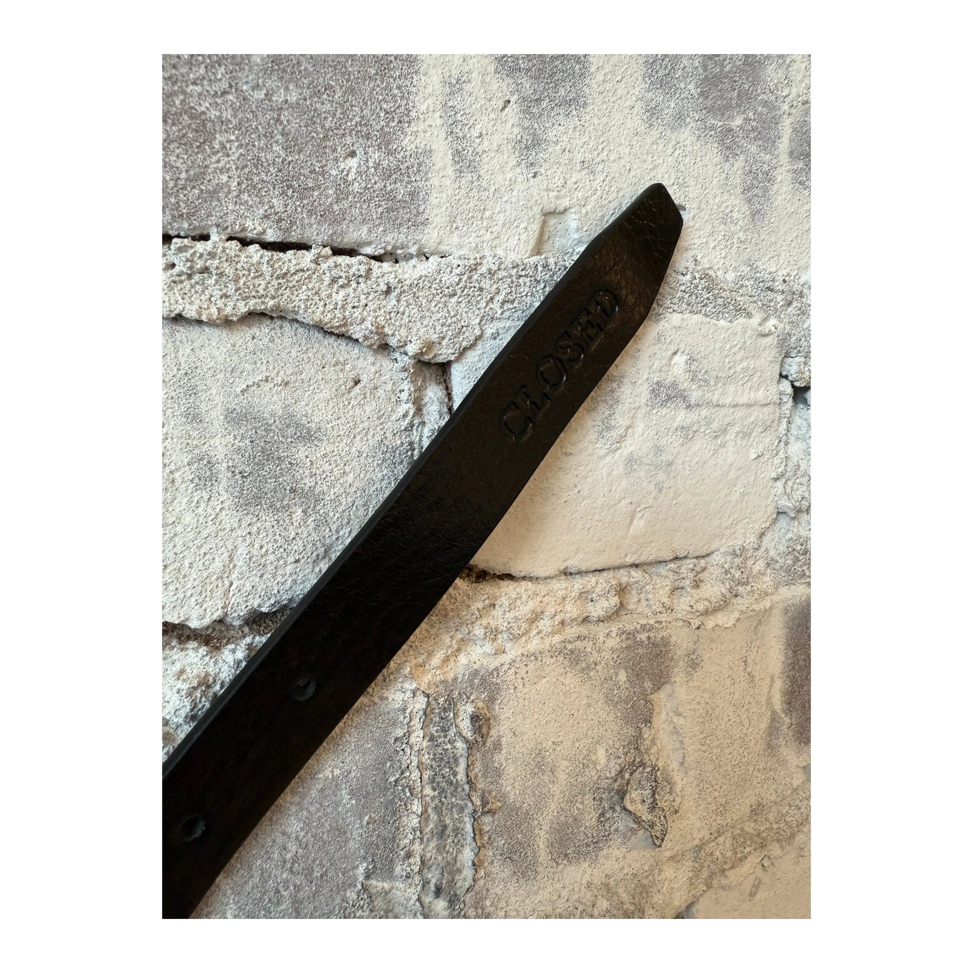Black leather women's belt with metal buckle from Closed Women's, featuring a sleek and stylish design.