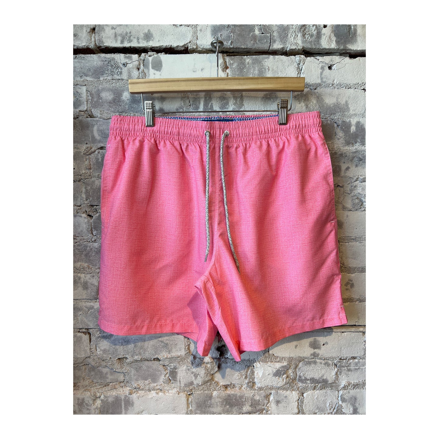 Men's cyclist liner swim trunks in coral solid linen by Michael's Swim, featuring a close-up of the fabric and waistband.
