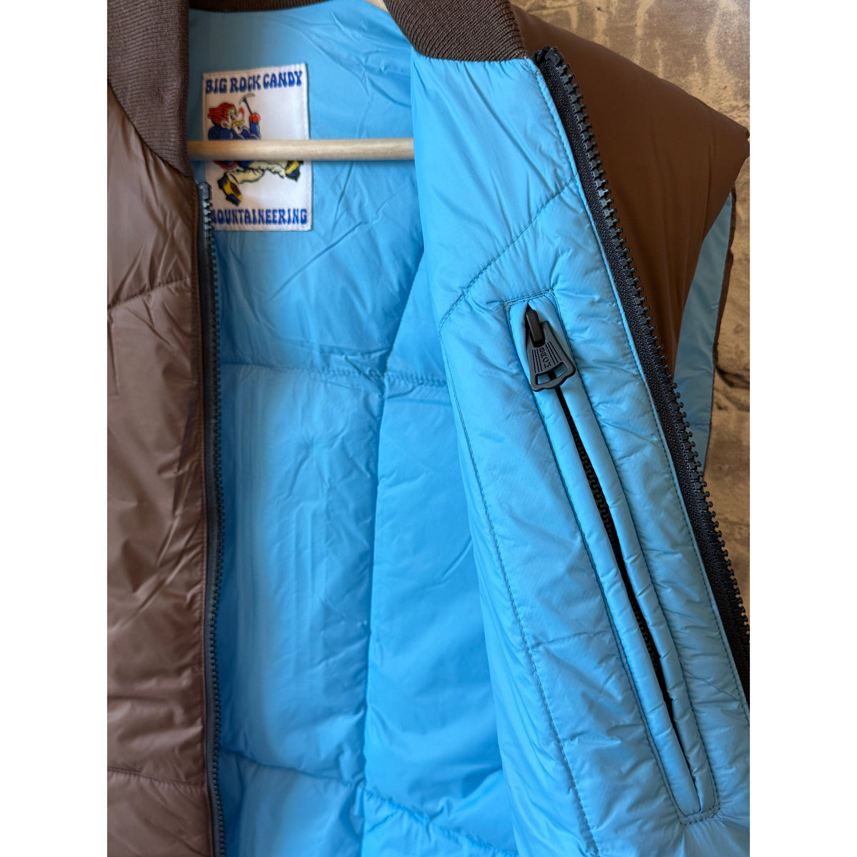 Men's Minarets Vest by Big Rock Candy Mountaineering in cappuccino color, showcasing the lightweight, insulated outdoor vest.