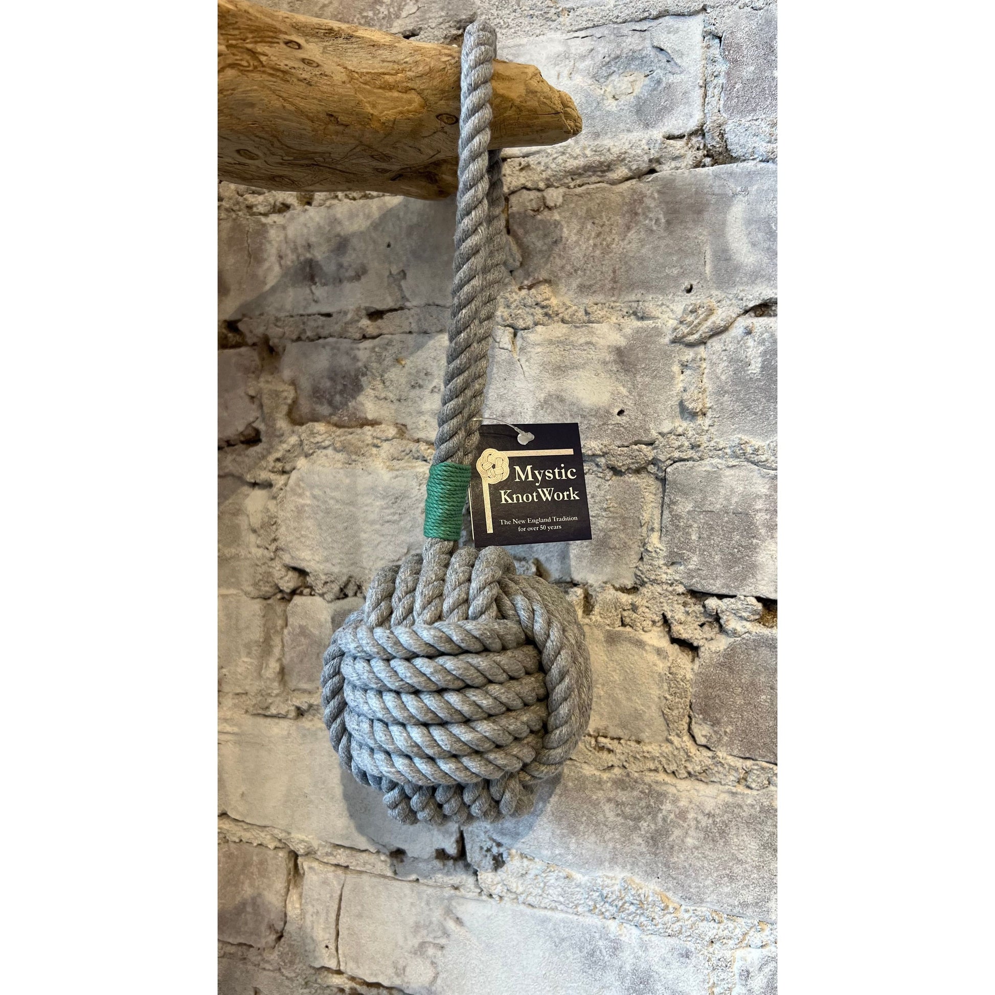 Large gray and green Monkey Fist Rope Dog Toy by Mystic Knotworks, durable accessory with a knotted design for dogs.