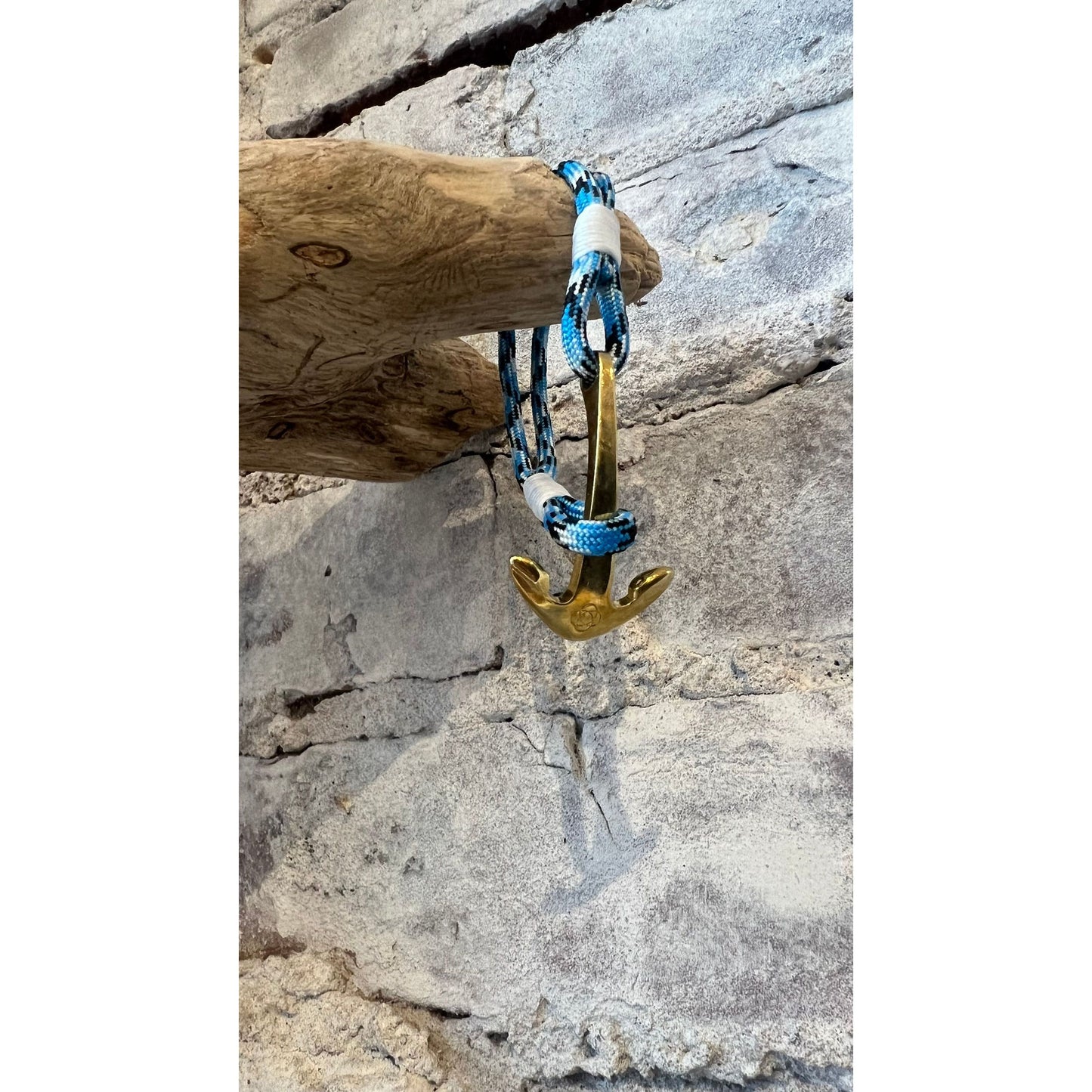 Blue Ice Nautical Brass Anchor Bracelet by Mystic Knotworks, featuring a brass anchor charm on a blue cord jewelry piece.