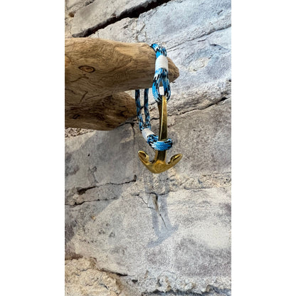 Blue Ice Nautical Brass Anchor Bracelet by Mystic Knotworks, featuring a brass anchor charm on a blue cord jewelry piece.