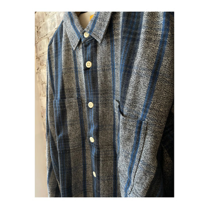 Men's N°111 round tail over shirt in gray, blue, and black from Madras Trading, displayed on a hanger.