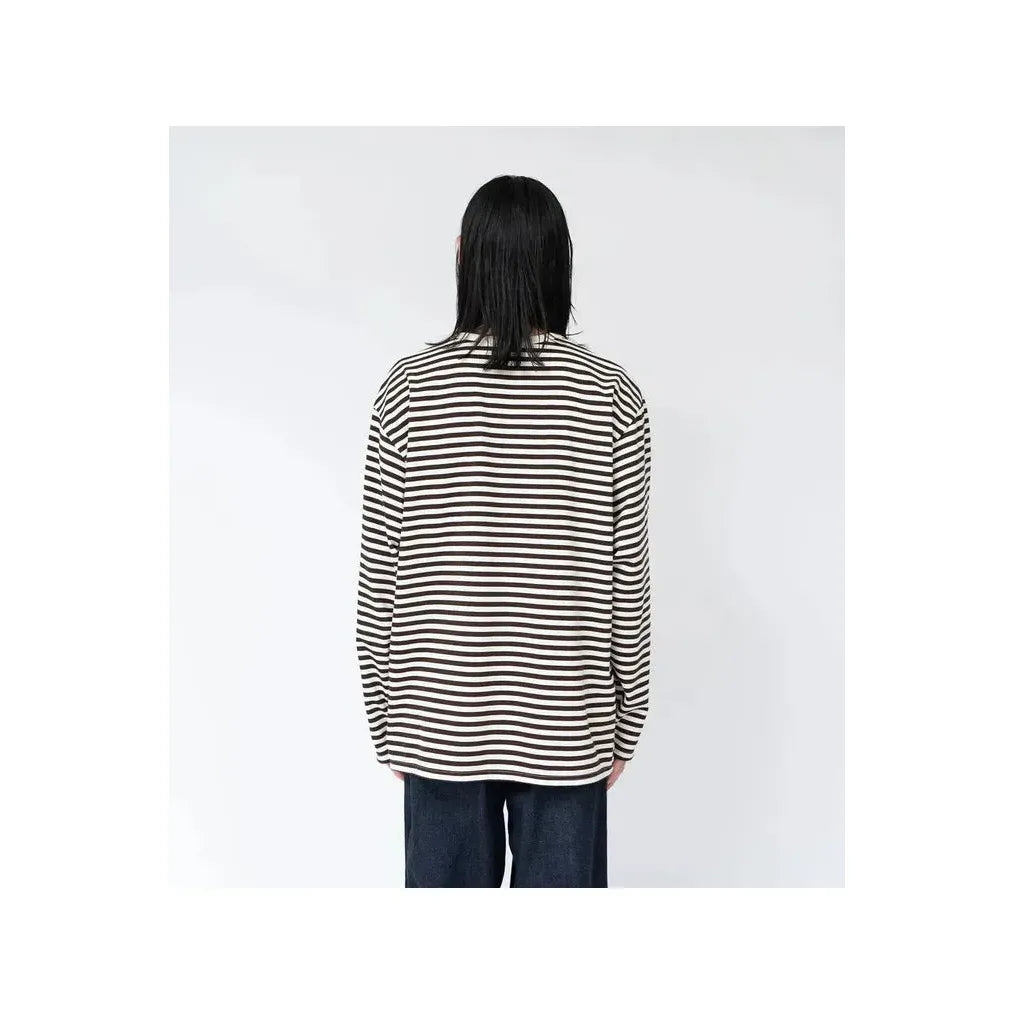 Men's navy and white COOLMAX Stripe Jersey long-sleeve T-shirt by nanamica, featuring a striped pattern and comfortable fabric.