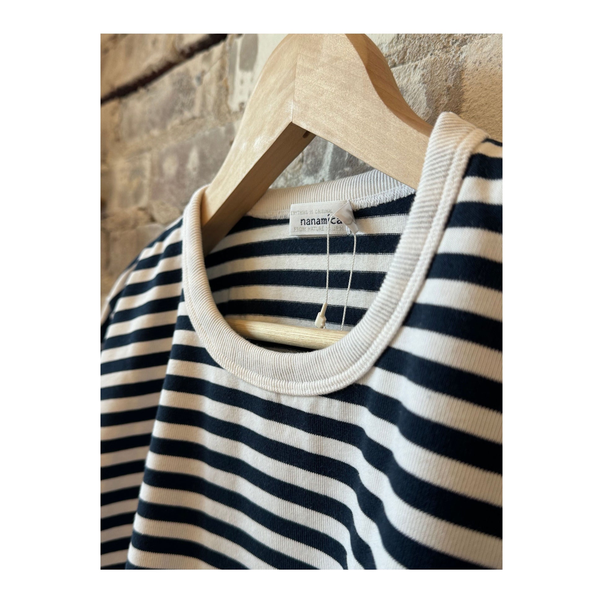 Men's navy and white COOLMAX Stripe Jersey long-sleeve T-shirt by nanamica, featuring a striped pattern and comfortable fabric.
