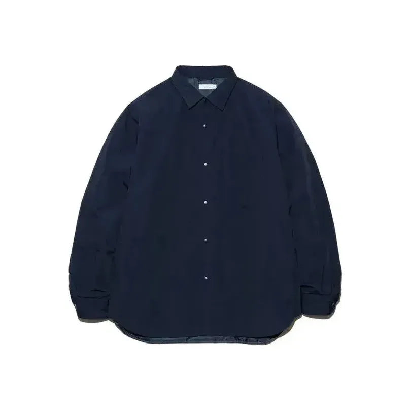 Men's dark navy insulation shirt jacket by nanamica, showing the lightweight, quilted design with a collar and front zipper.