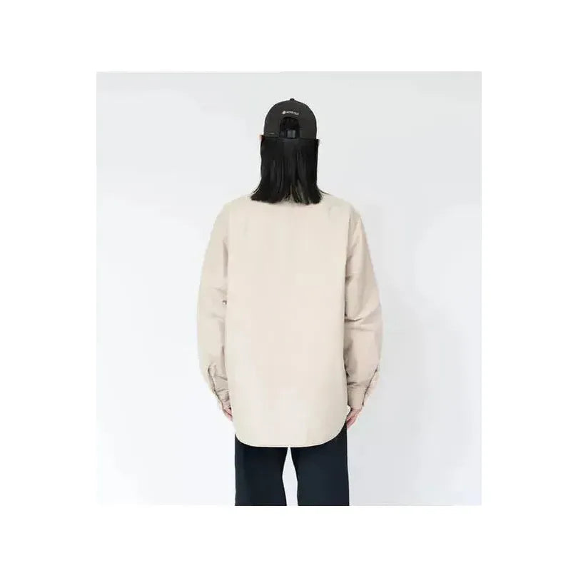 Men's dark navy nanamica insulation shirt jacket, lightweight with a stand collar and front button closure, suitable for layered wear.