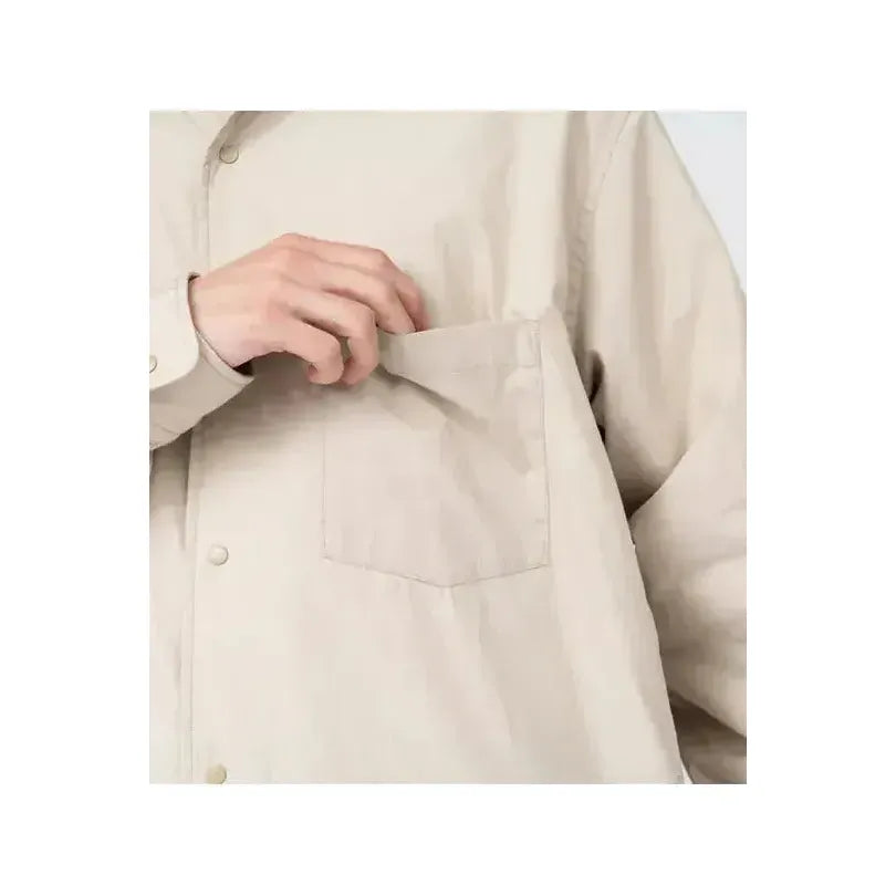 Men's nanamica insulation shirt jacket in dark navy, featuring a quilted design and lightweight, warm fabric for cold weather.