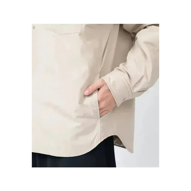 Men's dark navy nanamica insulation shirt jacket with a quilted design, featuring a stand collar and front button closure.