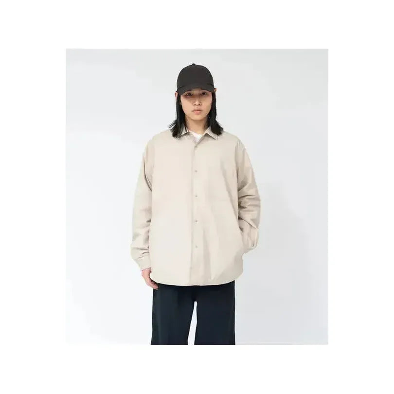 Men's nanamica insulation shirt jacket in dark navy, featuring a quilted design and button-up front for casual warmth and style.