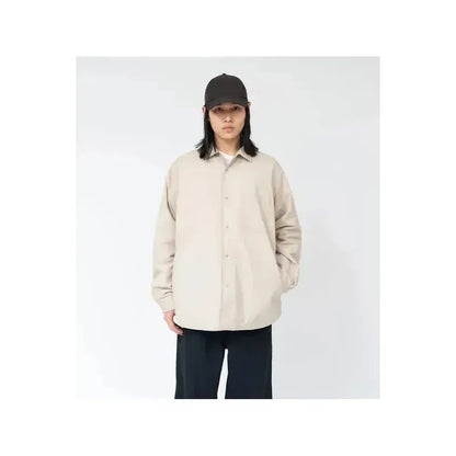 Men's nanamica insulation shirt jacket in dark navy, featuring a quilted design and button-up front for casual warmth and style.