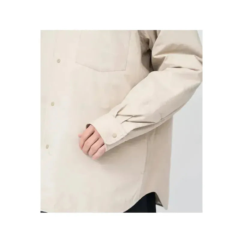 Men's dark navy nanamica insulation shirt jacket with quilted design and front pockets, suitable for casual outdoor wear.