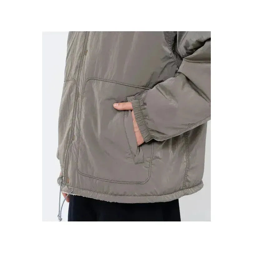 Men's reversible wind jacket in beige by nanamica, showing both the outer and inner sides with a lightweight, windproof design.