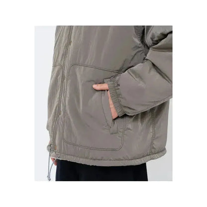 Men's reversible wind jacket in beige by nanamica, showing both the outer and inner sides with a lightweight, windproof design.