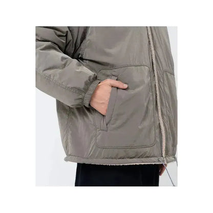 Men's reversible wind jacket in beige by nanamica, featuring lightweight fabric and versatile design for outdoor wear.